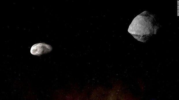 یک سیارک و قمر آن از کنار زمین می گذرند